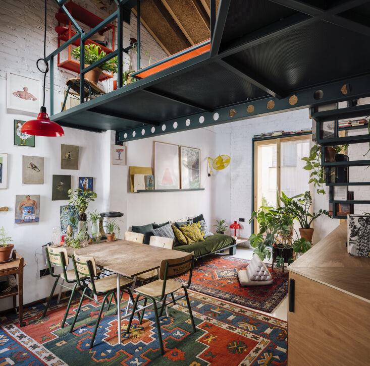 the mezzanine rises above the living room and kitchen and lends the space an ur 17