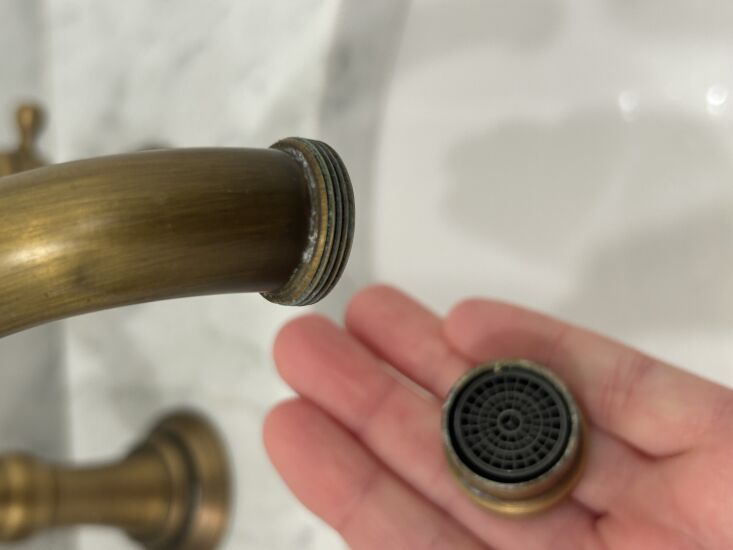 a removed sink aerator ready for cleaning. photograph by lacey soslow/ matriarc 18