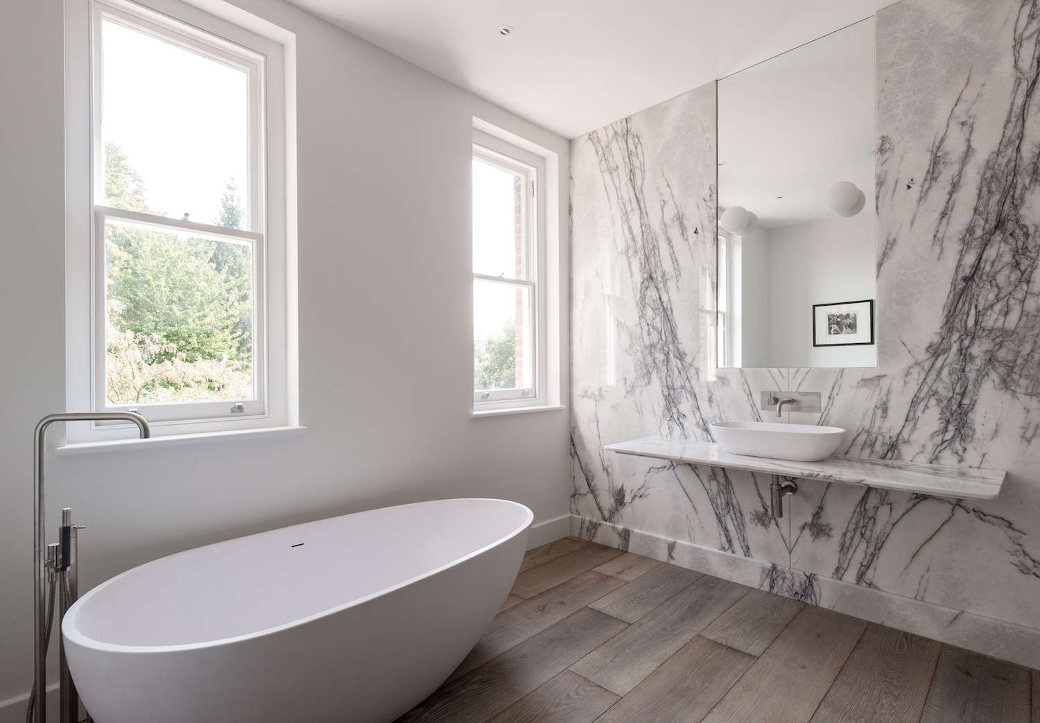 white marble slab bathroom with contemporary freestanding bathtub 18