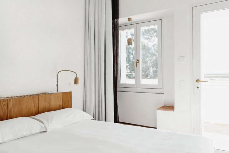 the bedroom lights, sconces, and pendants are made of cork and brass by the hom 30
