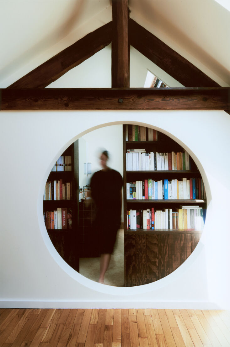 the bookcases are made of stained pine plywood and easily slide to open. the ex 24