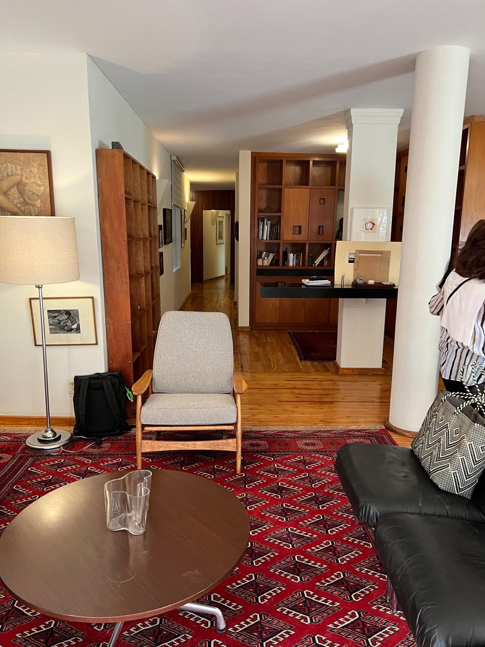 the living room formerly flowed into a library, now the kitchen. 35