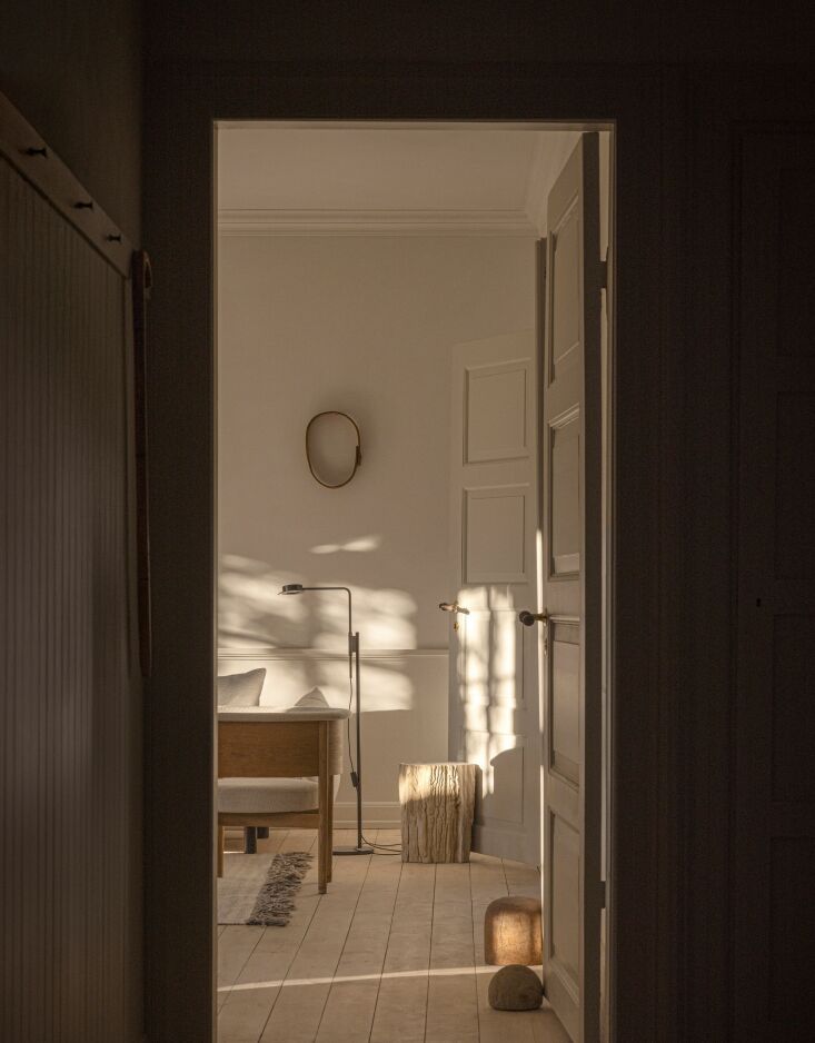 a look into the living room reveals a wästberg w\10\2 chipperfield floor lamp, 26