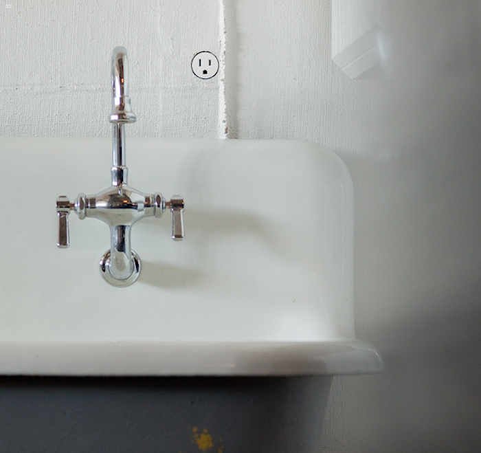 a single bocci \2\2 outlet inset into a bathroom wall.hotograph of a remodel 18