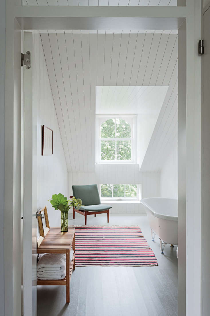 a scandi style attic bath in brooklyn gets a dose of color via a striped rug;  17