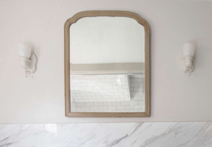 the wood framed mirror was one of several found in the existing farmhouse; its  18