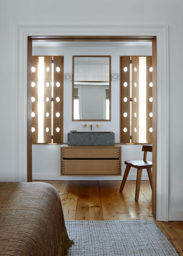 the main bedroom features the ensuite bath, with pocket doors opening to a full 17