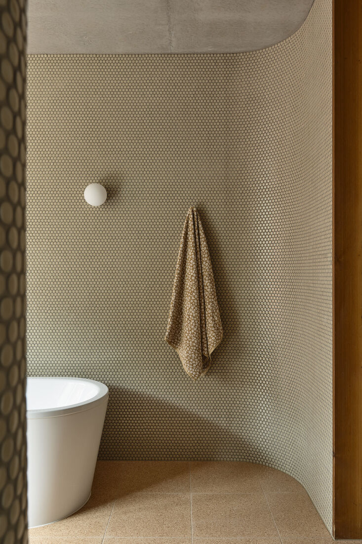 the bath is open to the rest of the room in this project by kennedy nolan (note 19