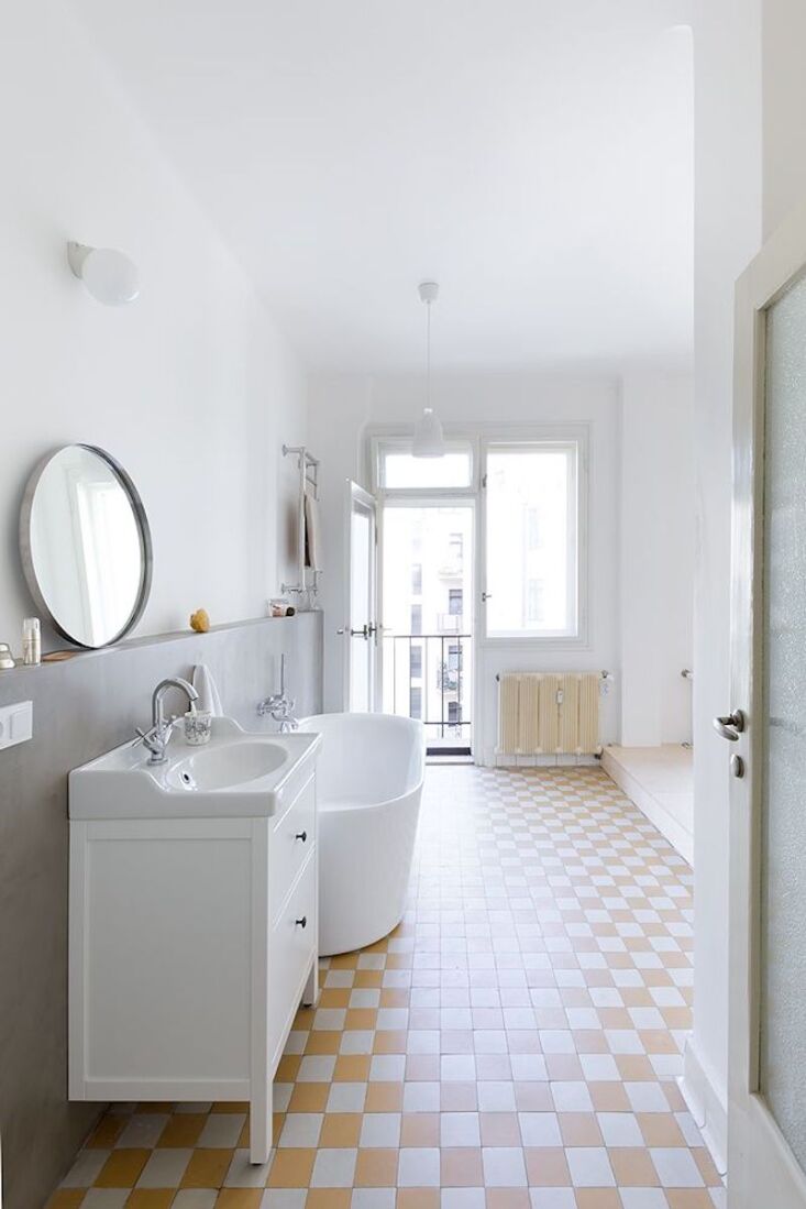 a view of the bath fixtures, both traditional and modern, along with a checkerb 18