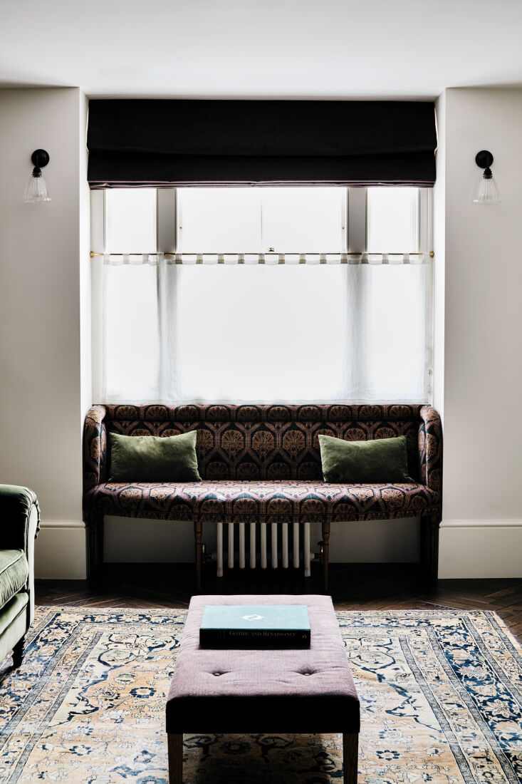 a window seat is upholstered in a robert kime velvet. 26