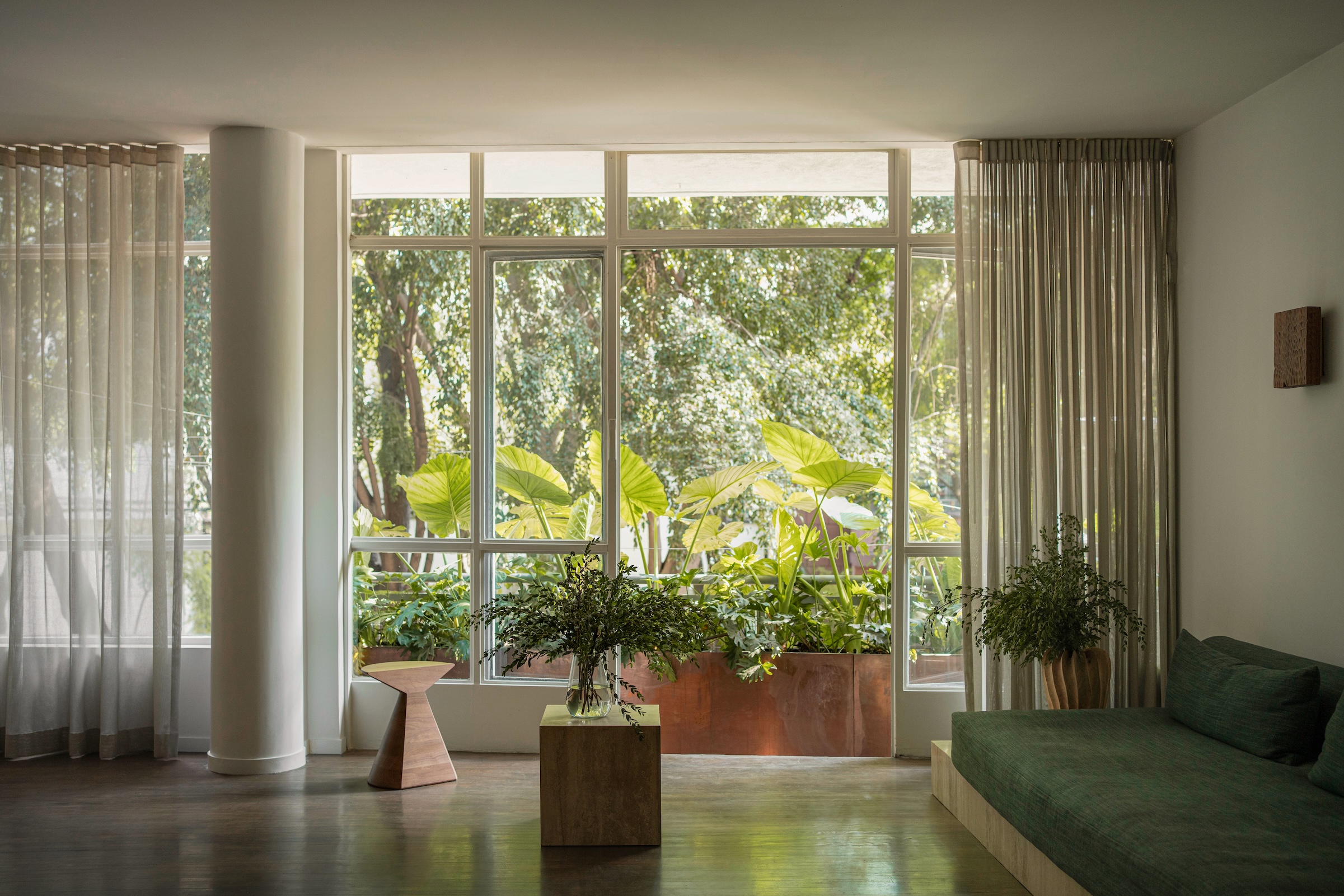 the living room\2\17;s wall of windows are original and are what sold th 22