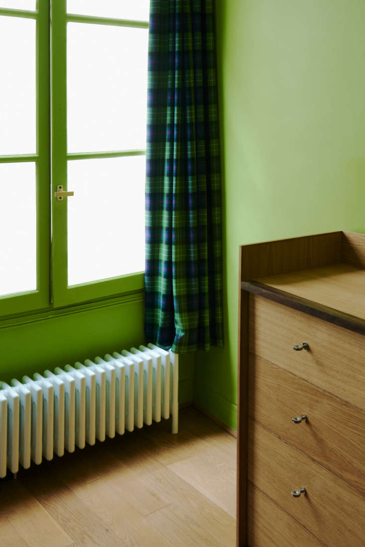 the custom chest of drawers, of oak with walnut detailing, is a companion to th 24