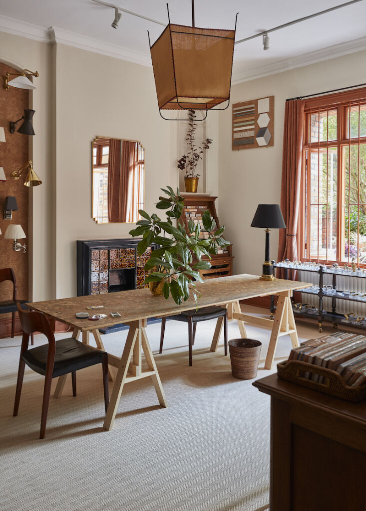 a temporary cork trestle table stands in the center of the room. (there are sti 23