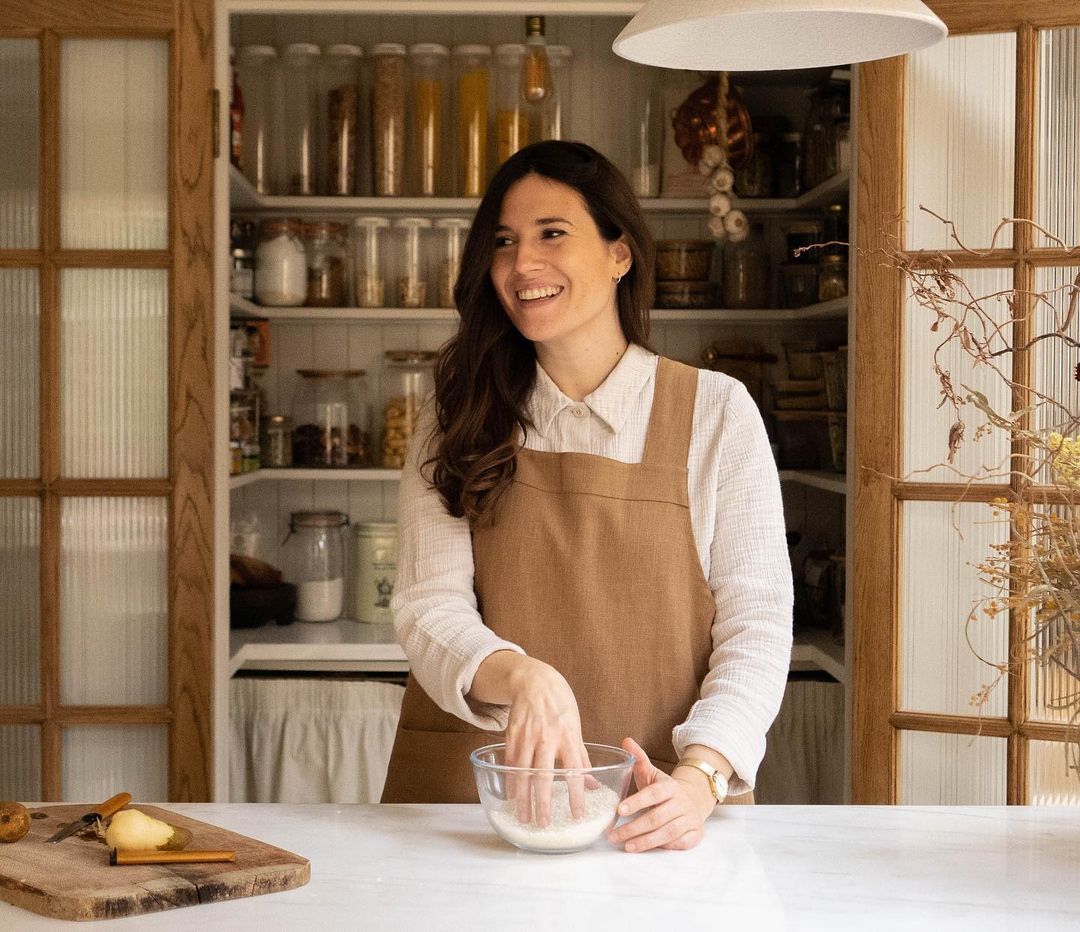 a pantry with  fluted glass doors takes center stage in graphic designer marti 21