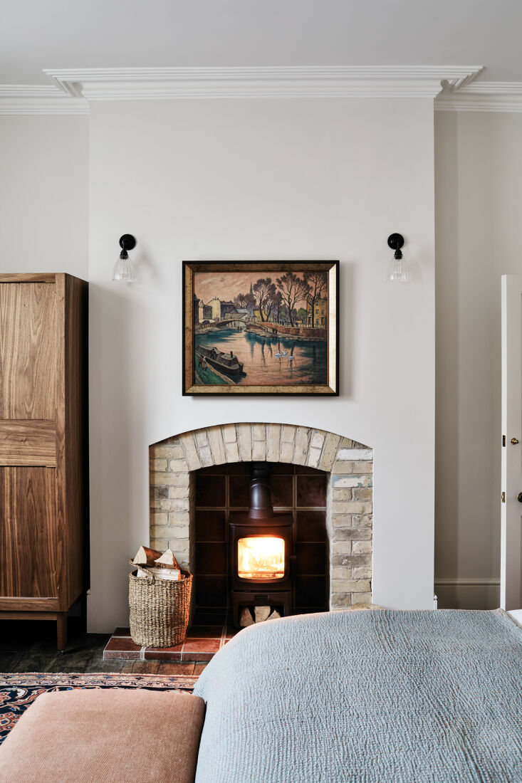 the new fireplace is composed of old brick and salvaged encaustic tile. 33