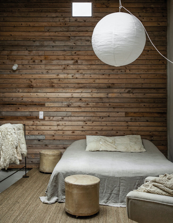 in one of the bedrooms, the moores introduced a paneled wood wall as \2\ 21