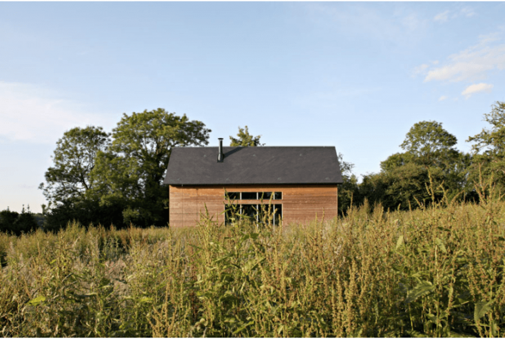 In order to keep costs down, interior walls are clad in unfinished plywood and floors are covered in black rubber, which is great for insulation and sound proofing.
