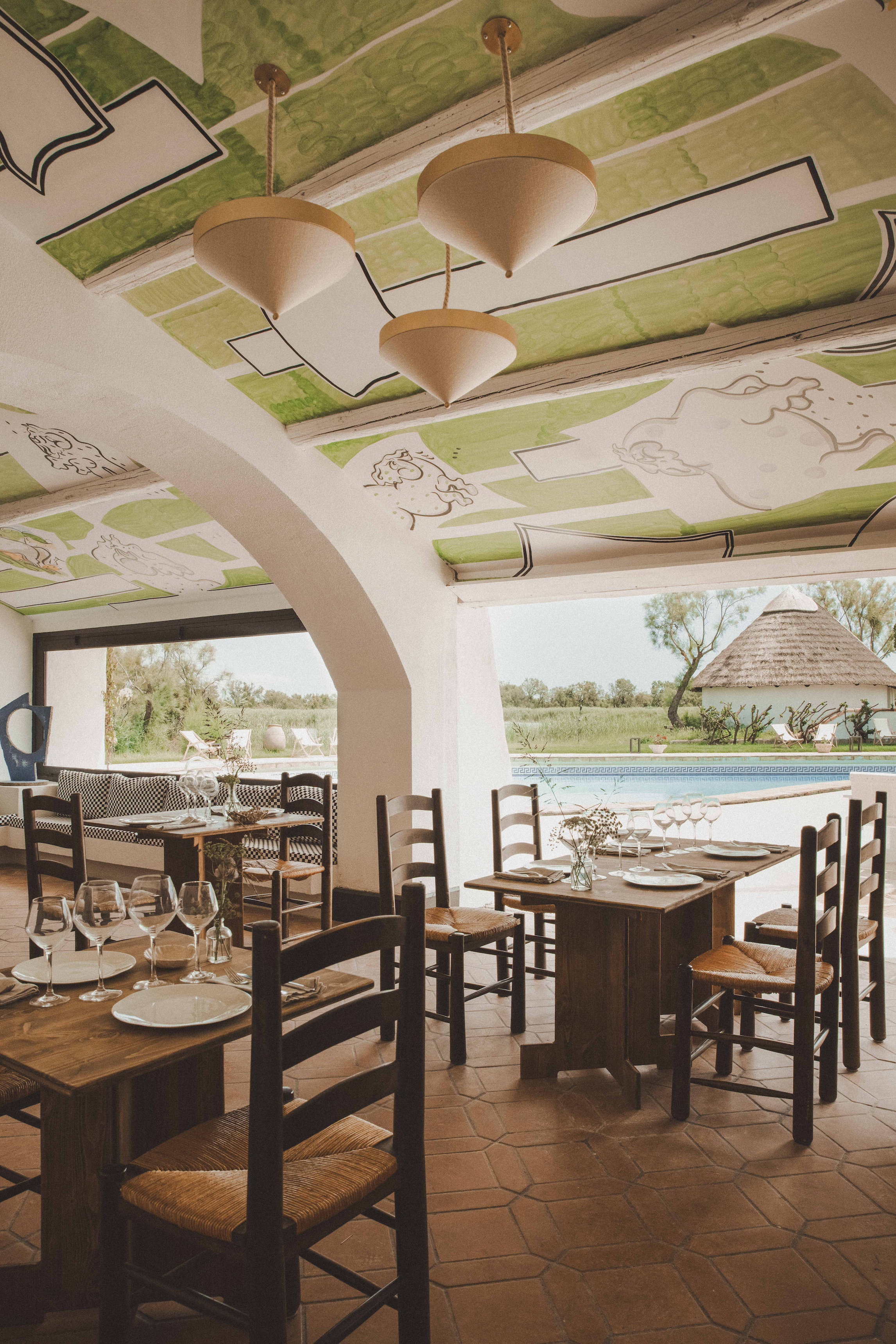 poolside dining. the overhead murals are by perrine boudy. 28