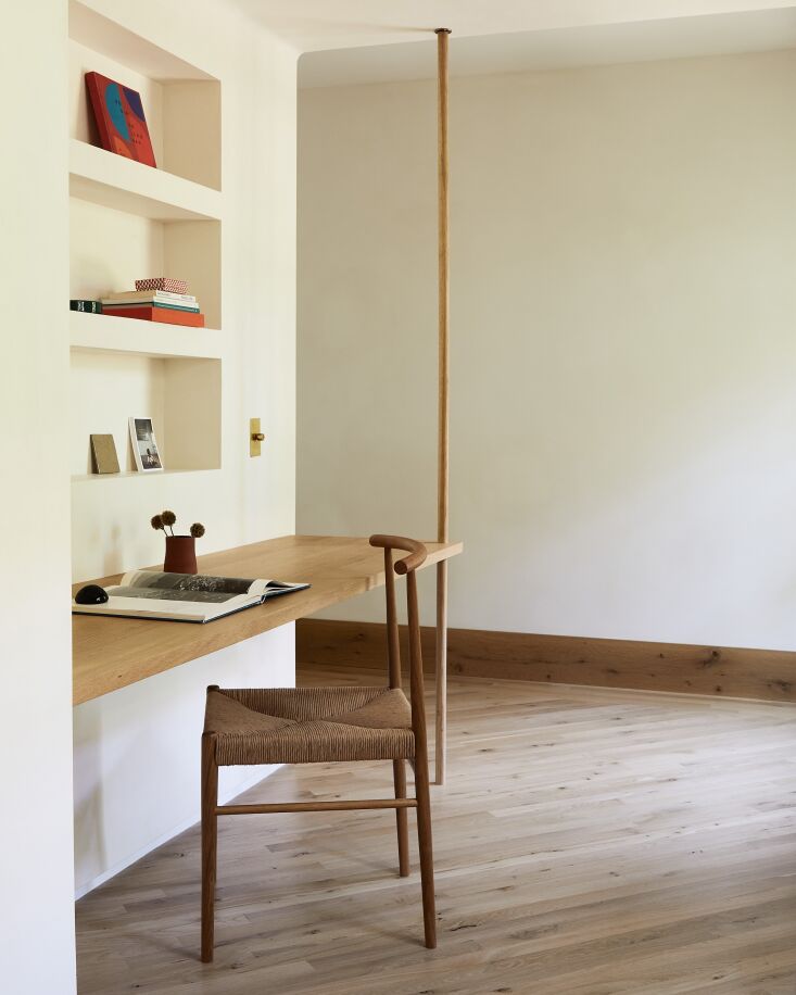alongside the inglenook, there\2\17;s a built in desk for two with a flo 30