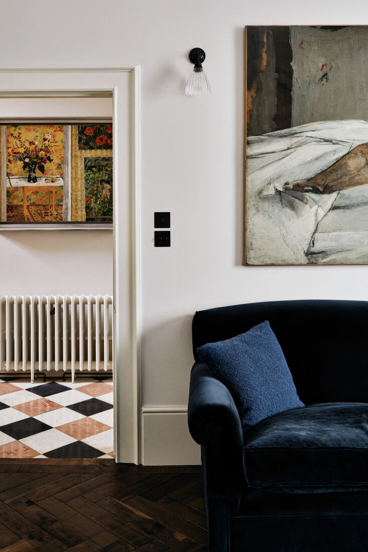 the combination living room/study is more formal than the downstairs living spa 29