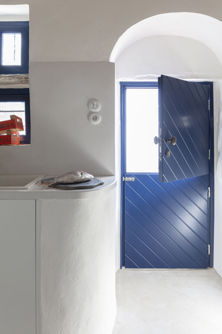 a dutch door leads to a courtyard and series of gardens—there are lemon trees 24