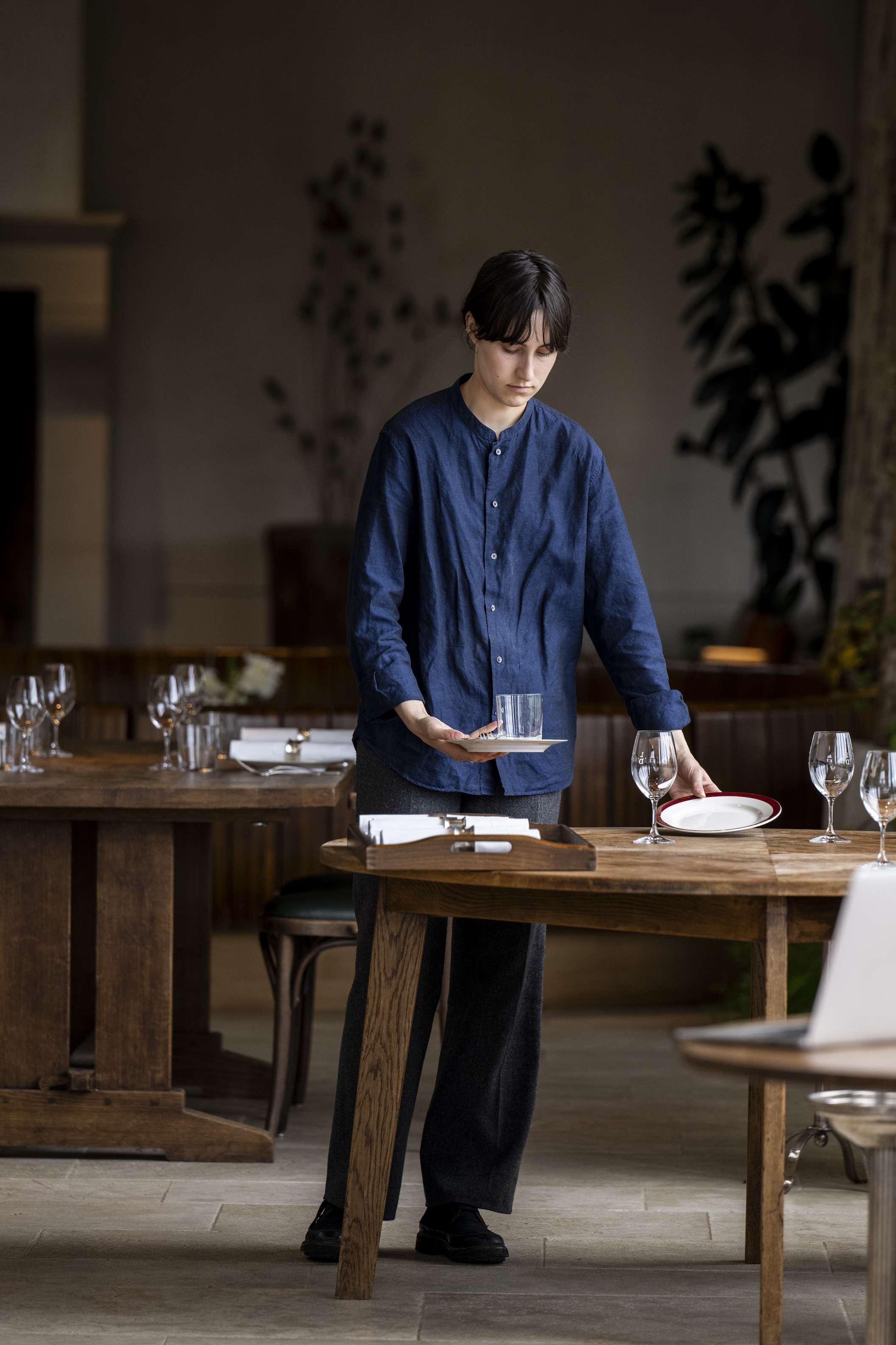 the soaring space is furnished with classic wooden tables and bentwood chairs. 20